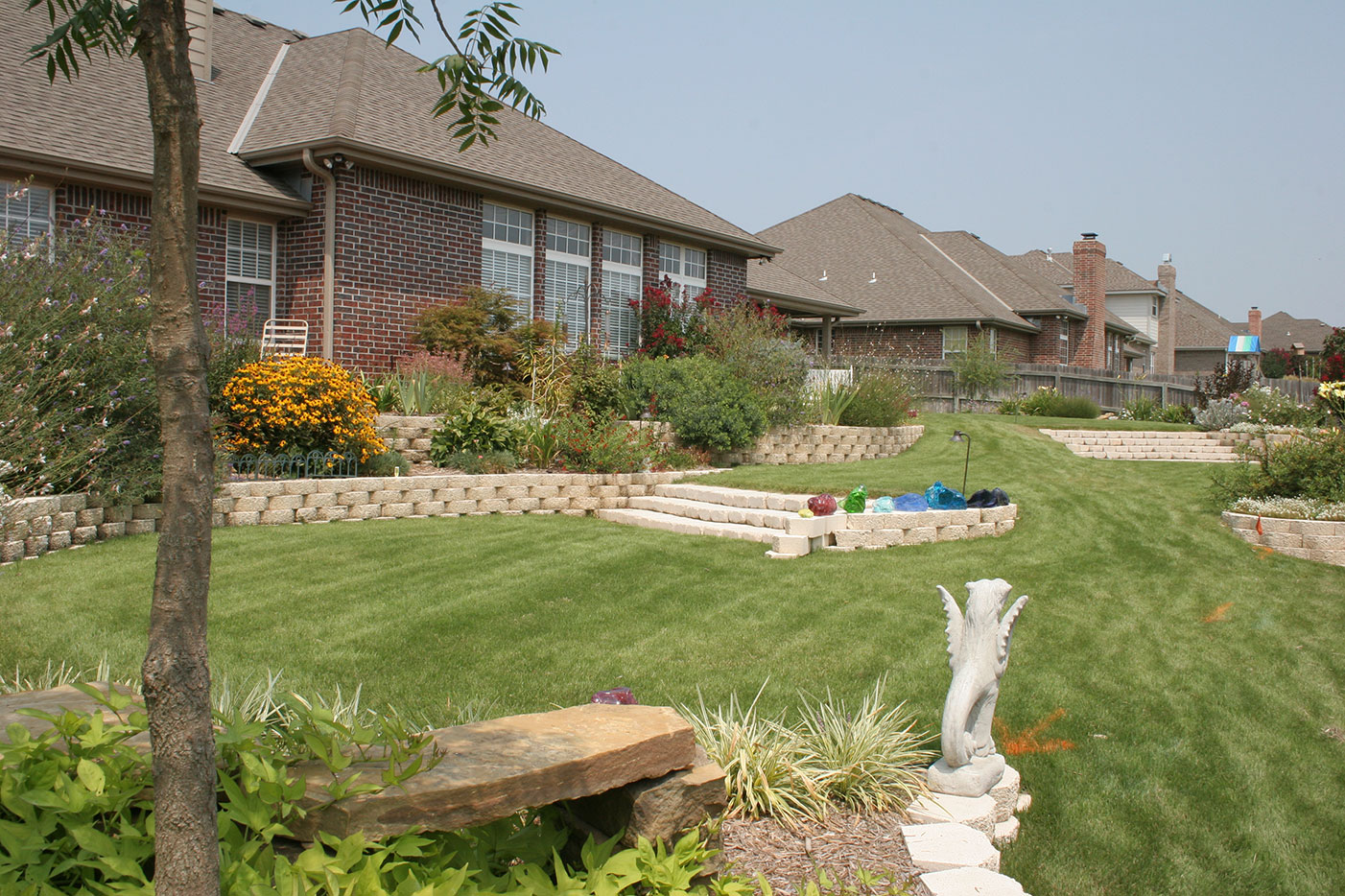Outdoor landscape with mature planting and lawn